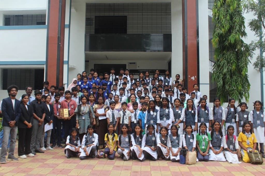 Students and faculty celebrating with award at partner institution